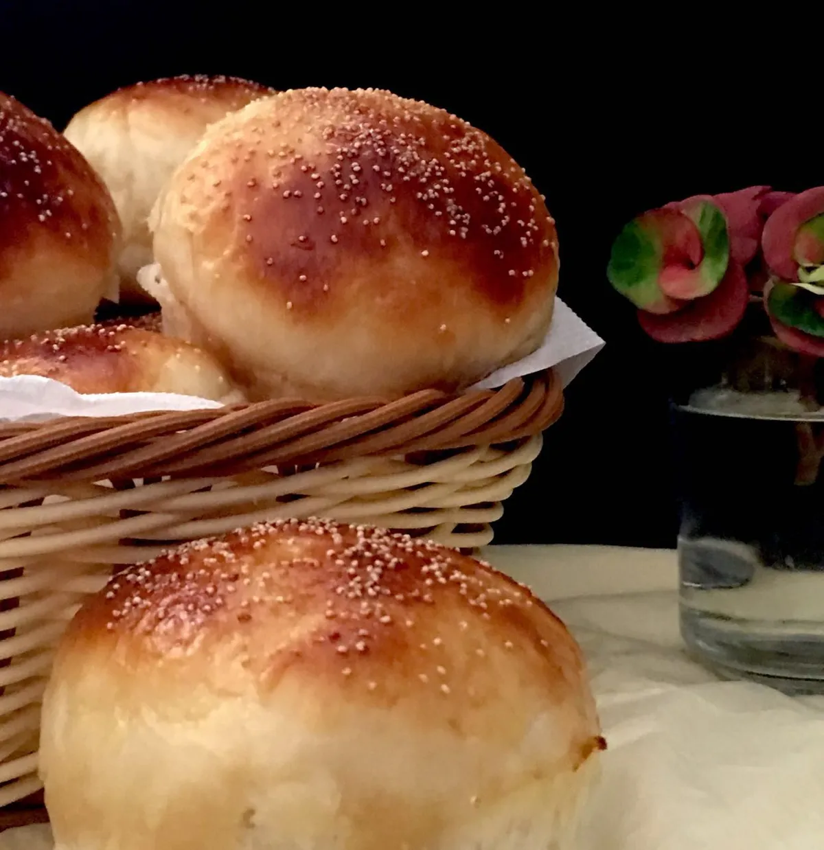 Soft buns with coconut ,salted cashew nut ,and raisin filling and topped with poppy seeds and honey glaze