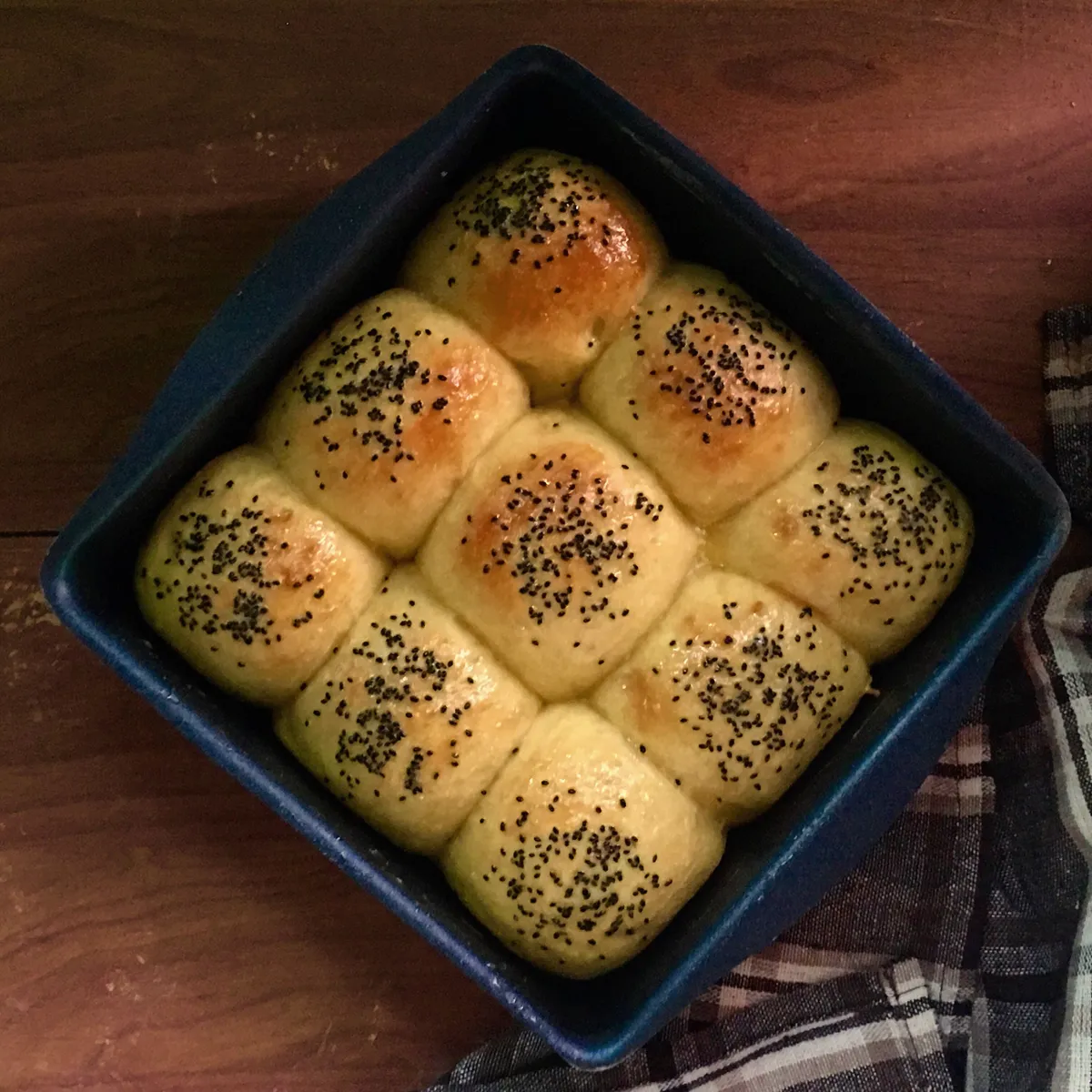 Soft buns flavoured with roasted pumpkin and topped with basil seeds..